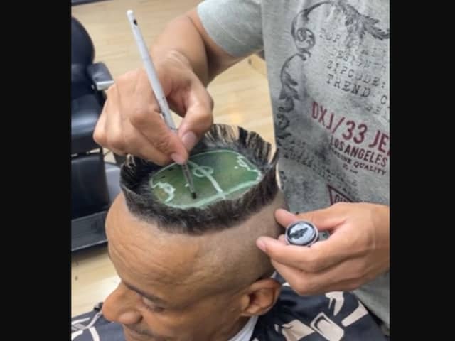 A hair artist created a miniature football stadium on a client's head.