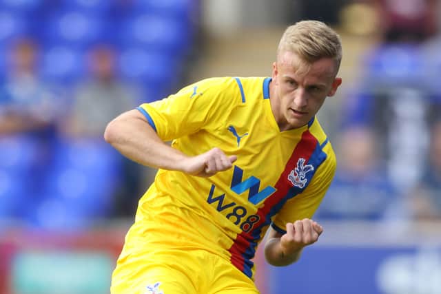 Reece Hannam of Crystal Palace runs with the ball during the pre-season friendly match. Credit: Paul Harding/Getty Images