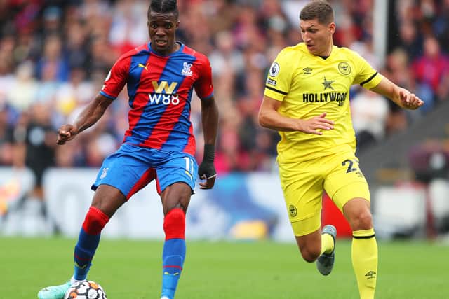 Wilfried Zaha of Crystal Palace with Vitaly Janelt (Photo by Julian Finney/Getty Images)