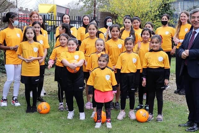 The club has been successful by addressing cultural sensitivities, from female-only coaches to sport hijabs donated by Nike. Credit: Abresham Girl’ Club