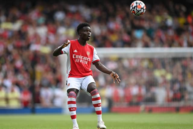 Bukayo Saka of Arsenal controls the ball during the Premier League match  (Photo by Shaun Botterill/Getty Images)