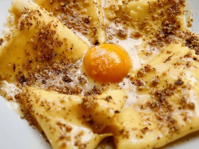 Bancone’s signature dish of ‘silk handkerchiefs’ with walnut butter and confit egg yolk. Credit: Bancone/Instagram