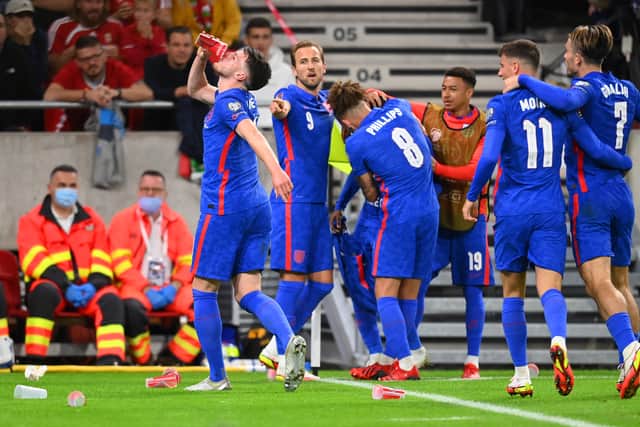 Declan Rice drinks some of the beer hurled at Raheem Sterling. Credit: Getty 