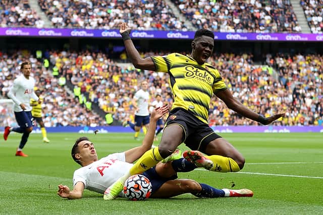 Ismaila Sarr of Watford battles for possession with Sergio Reguilon of Tottenham Hotspur (Photo by Catherine Ivill/Getty Images)
