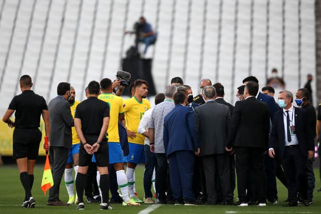 Health authorities interrupt the match between Brazil and Argentina Photo by Alexandre Schneider/Getty Images)