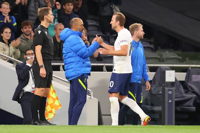 Nuno Espirito Santo, manager of Tottenham Hotspur interacts with Harry Kane (Photo by Catherine Ivill/Getty Images)