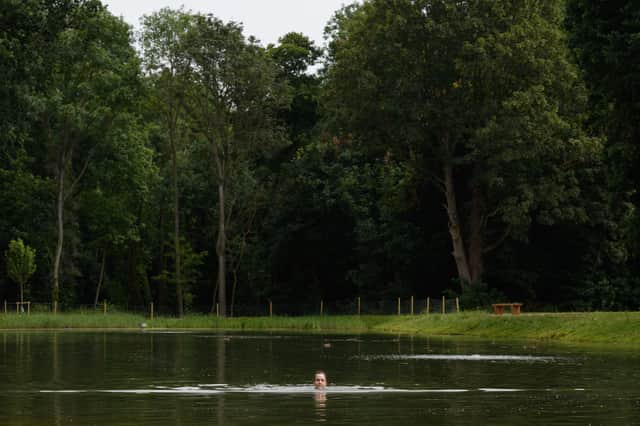 A woman swims in Beckenham Place Park’s swimming lake after it was restored in 2019. Credit: Leon Neal/Getty Images