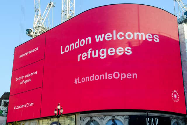 The London Mayor’s Welcome Message to the Afghan Refugees is displayed at Piccadilly Circus. Photo by Joe Maher/Getty Images