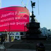 The London Mayor’s Welcome Message to the Afghan Refugees is displayed at Piccadilly Circus. Credit: Photo by Joe Maher/Getty Images