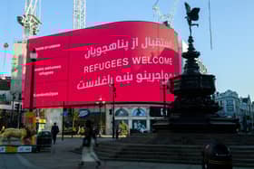 The London Mayor’s Welcome Message to the Afghan Refugees is displayed at Piccadilly Circus. Credit: Photo by Joe Maher/Getty Images