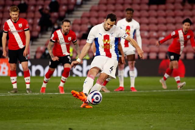 Luka Milivojevic of Crystal Palace takes a penalty that is saved by Fraser Forster (Photo by Andrew Boyers - Pool/Getty Images)