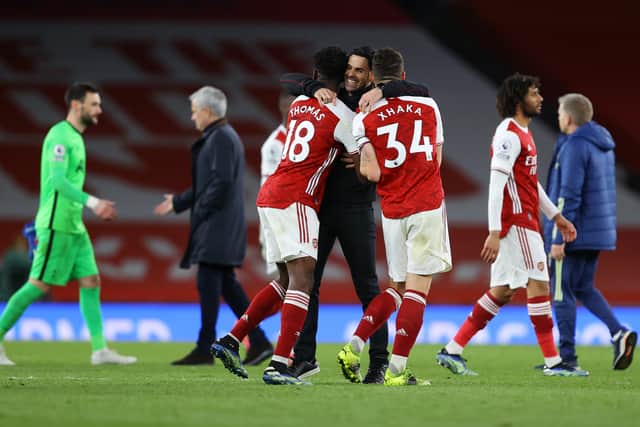 Mikel Arteta, Manager of Arsenal celebrates victory with Thomas Partey and Granit Xhaka  (Photo by Julian Finney/Getty Images)