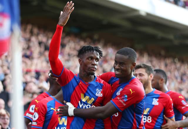 <p> Wilfried Zaha of Crystal Palace celebrates after scoring (Photo by Alex Morton/Getty Images)</p>