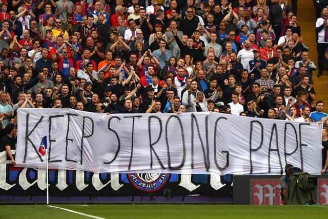 Crystal Palace fans display a banner for Pape Souare of Crystal Palace during the Premier League match (Photo by Ian Walton/Getty Images)