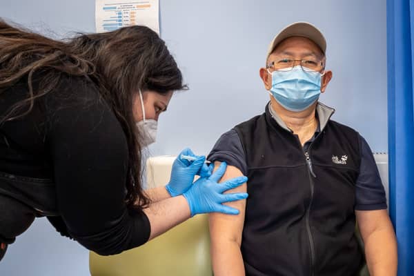 Booster jabs are being rolled out to over-50s. Pictured, a man is given a Covid vaccine at a London vaccination centre.