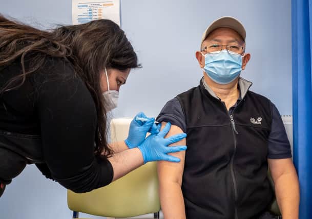 Booster jabs are being rolled out to over-50s. Pictured, a man is given a Covid vaccine at a London vaccination centre.