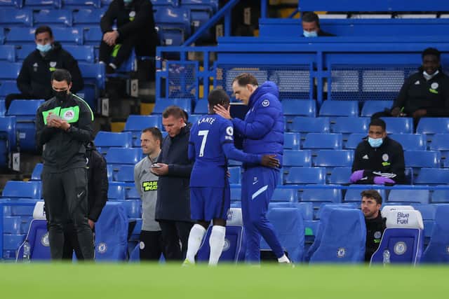 N'Golo Kante of Chelsea is consoled by Thomas Tuchel, Manager of Chelsea  (Photo by Catherine Ivill/Getty Images)