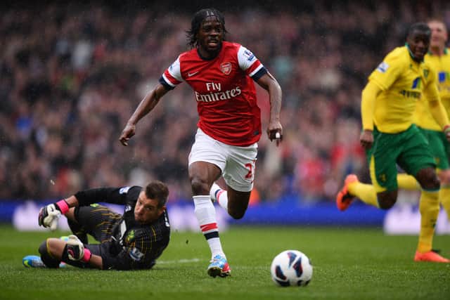 Gervinho of Arsenal in action against Mark Bunn of Norwich City during the Barclays Premier League (Photo by Mike Hewitt/Getty Images)