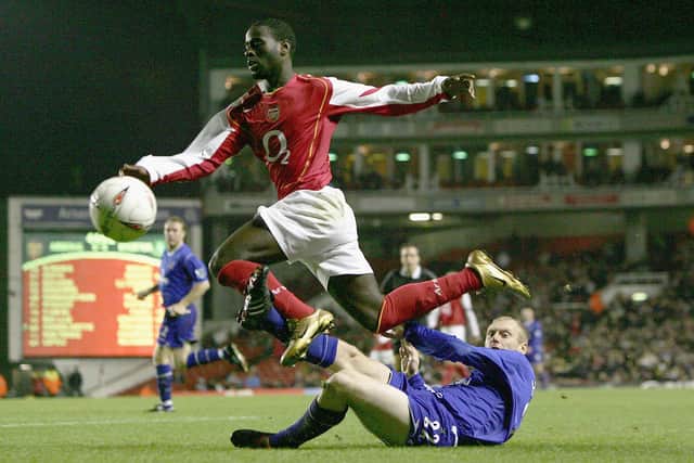 Quincy Owusu-Abeyie of Arsenal is tackled by Tony Hibbert of Everton during the Carling Cup (Photo by Ben Radford/Getty Images)