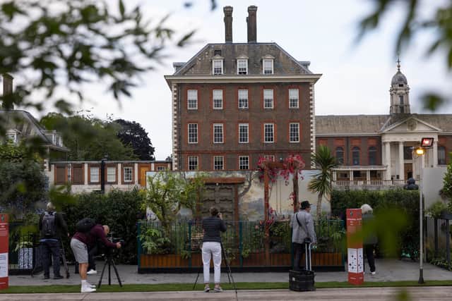 Visitors look at a garden display on Chelsea Flower Show preview day. Credit: Getty Images