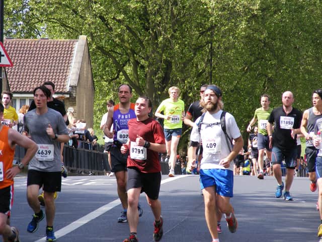 <p>Runners in the Hackney Half Marathon. Credit: Wikimedia Commons/Sludgegulper</p>