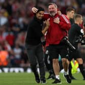 Mikel Arteta, Manager of Arsenal celebrates their side’s victory with the Arsenal Club Photographer Photo by Julian Finney/Getty Images)