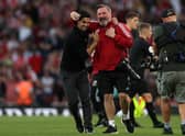 Mikel Arteta, Manager of Arsenal celebrates their side’s victory with the Arsenal Club Photographer Photo by Julian Finney/Getty Images)