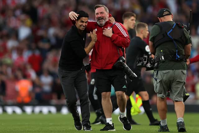 <p>Mikel Arteta, Manager of Arsenal celebrates their side’s victory with the Arsenal Club Photographer Photo by Julian Finney/Getty Images)</p>