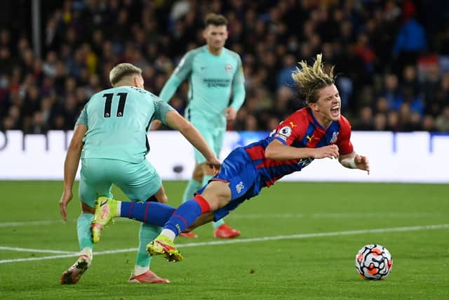 Leandro Trossard of Brighton & Hove Albion tackles Conor Gallagher of Crystal Palace leading to a penalty (Photo by Mike Hewitt/Getty Images)