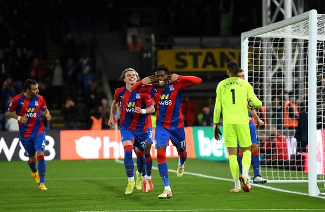 <p>Wilfried Zaha of Crystal Palace celebrates after scoring their team's first goal during the Premier League match (Photo by Mike Hewitt/Getty Images)</p>