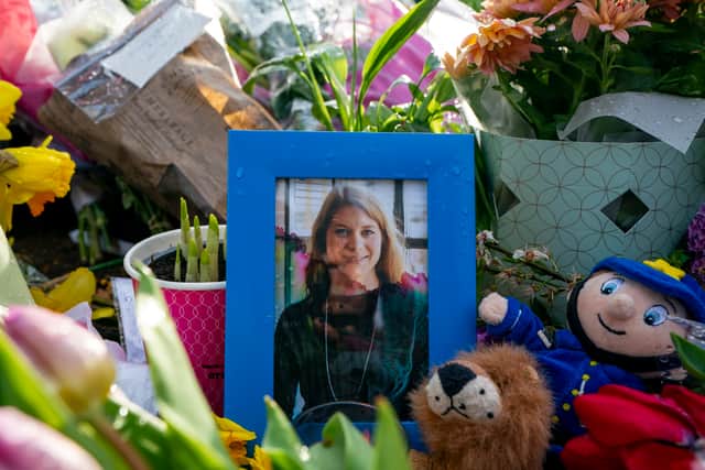 A picture of Sarah Everard sat amongst flowers left at the bandstand in Clapham Common on March 15, 2021 where hundreds of people turned out to pay tribute to the 33-year-old (image: Getty)