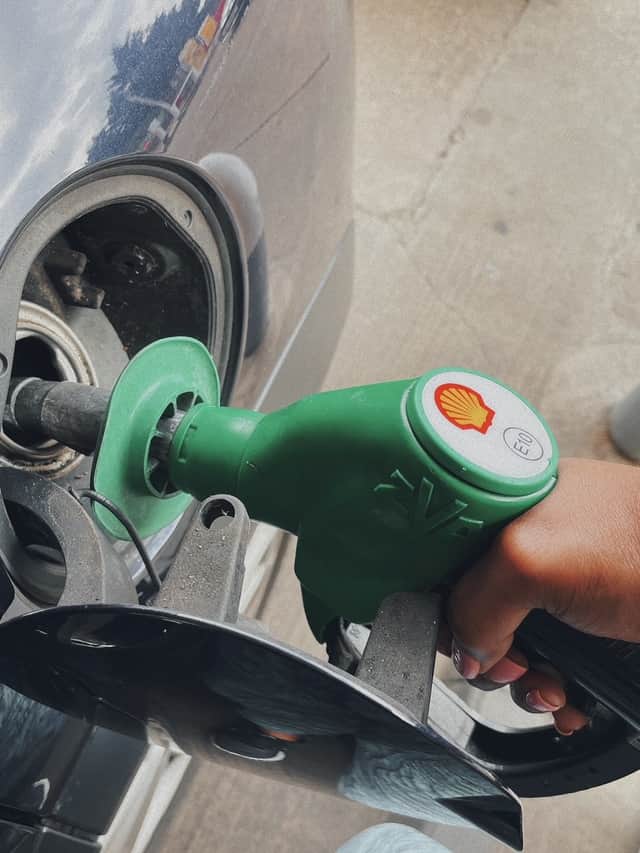 Lily Potkin finally filling up her car in Kingsbury, northwest London. Credit: Lily Potkin / SWNS.com