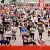 Runners compete the Virgin London Marathon 2019 on April 28, 2019, the last time ordinary runners could take part. (Photo by Jeff Spicer/Getty Images)