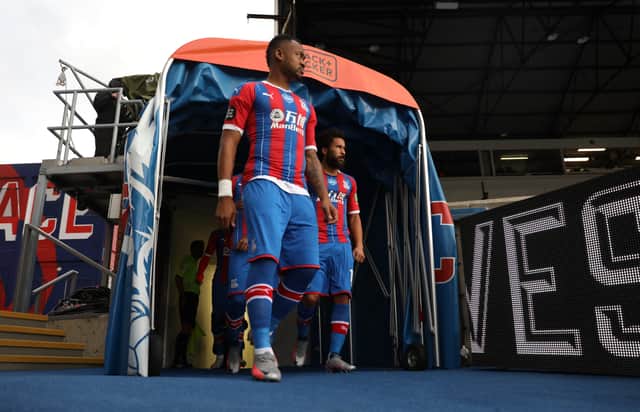 <p>Jordan Ayew and Andros Townsend of Crystal Palace walk out prior to the Premier League match (Photo by Hannah McKay/Pool via Getty Images)</p>
