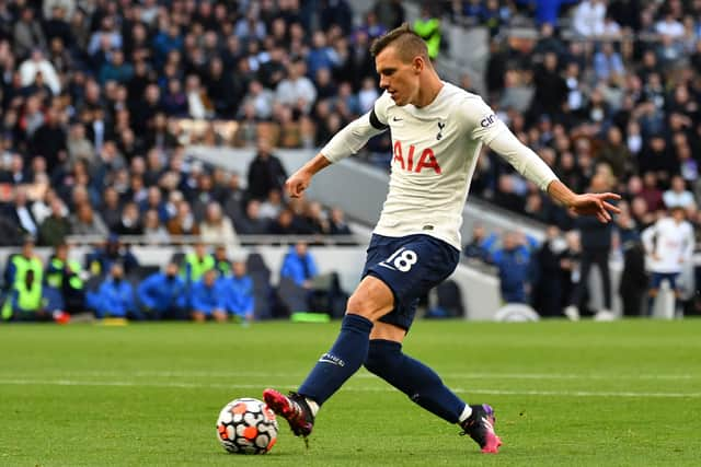 Argentinian midfielder Giovani Lo Celso passes the ball during the English Premier League football match (Photo by JUSTIN TALLIS/AFP via Getty Images)