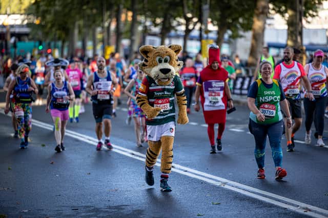 A runner dressed as a tiger on Victoria Embankment during the London Marathon on October 03, 2021 in London, England. (Photo by Rob Pinney/Getty Images)