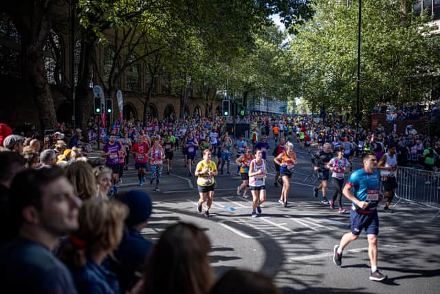 Runners on The Highway as they take part in the London Marathon at Tower Bridge on October 03, 2021 in London, England. (Photo by Rob Pinney/Getty Images)