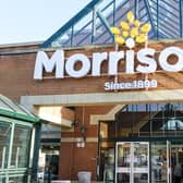 Shoppers outside the front of a Morrisons store in Hatch End, London.