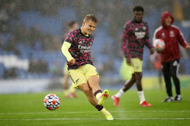 Martin Odegaard of Arsenal shoots during the warm up prior to the Premier League match  (Photo by Steve Bardens/Getty Images)