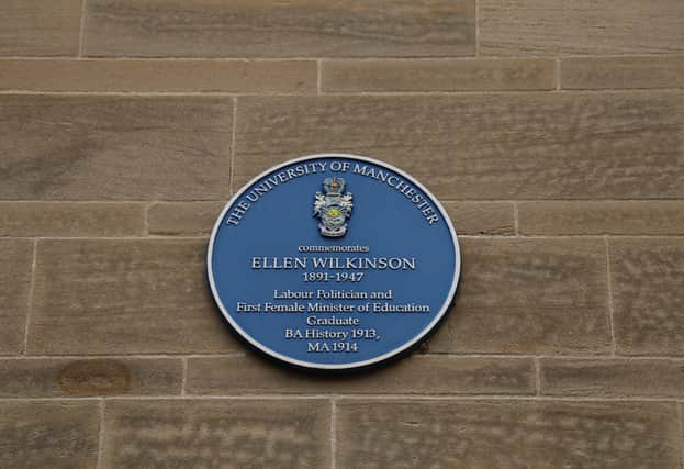 A blue plaque on the side of the University wall commemorating Ellen Wilkinson, Labour politician and first female Minister of Education.