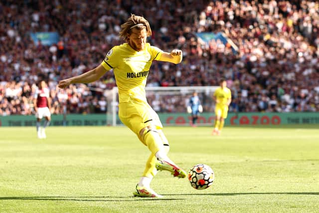 Mathias Jensen of Brentford has a shot on goal during the Premier League match between Aston Villa (Photo by Ryan Pierse/Getty Images)