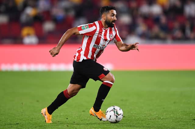 Saman Ghoddos of Brentford runs with the ball during the Carabao Cup Third Round match  (Photo by Alex Burstow/Getty Images)