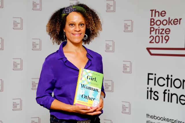 British author Bernardine Evaristo poses with her book ‘Girl, Woman, Other’ - which won the Booker Prize. Credit: TOLGA AKMEN/AFP via Getty Images
