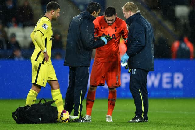 Hugo Lloris of Spurs receives treatment for an injury during the Barclays Premier League match  (Photo by Michael Regan/Getty Images)