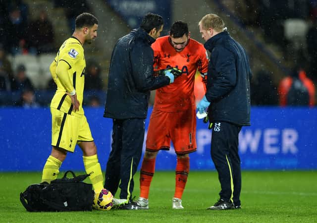 Hugo Lloris of Spurs receives treatment for an injury during the Barclays Premier League match (Photo by Michael Regan/Getty Images)