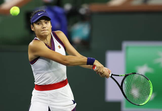 Emma Raducanu of Great Britain plays a backhand against Aliaksandra Sasnovich of Belarus (Photo by Clive Brunskill/Getty Images)