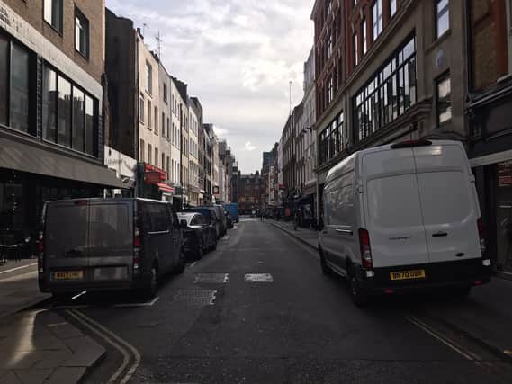 Cars and vans parked up in Soho’s narrow streets which earlier in the summer was filled with Londoners eating and drinking. Credit: Jacob Phillips