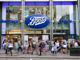 Members of the public walk past a branch of Boots the chemist (Pic from Getty)