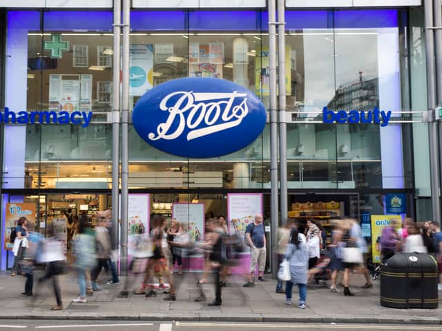 Members of the public walk past a branch of Boots the chemist (Pic from Getty)