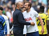 Tottenham Hotspur's English striker Harry Kane and Tottenham Hotspur's Portuguese head coach Nuno Espirito Santo (Photo by GLYN KIRK/AFP via Getty Images)